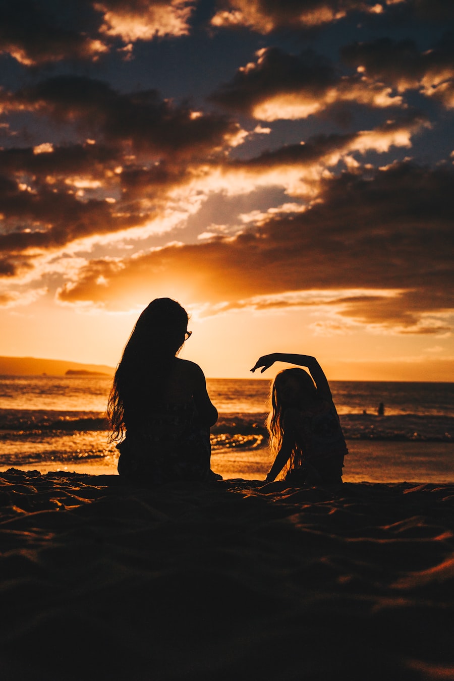 Mother and child silhouette at sunset